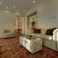 Chesterfield Schlafsofa,Tisch, Hotelraum